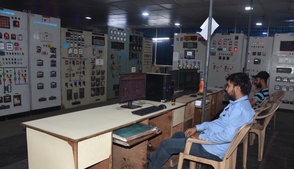 Operators at the cogeneration plant control panels