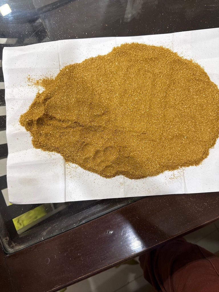 A spread of the finished DDGS — dried maize distillers grains, golden and granular