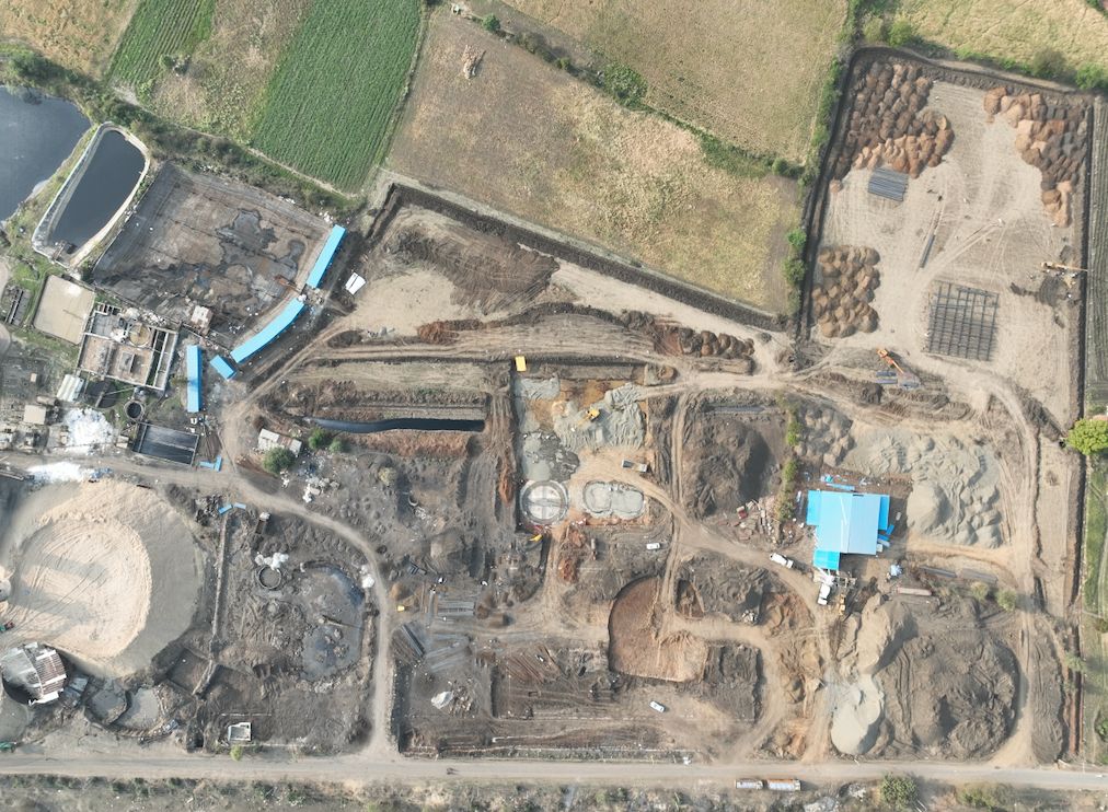 Aerial photograph of the site at Bachai, the plant among its fields.